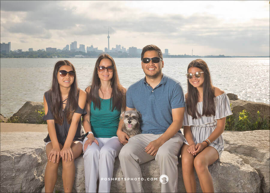 dog and family in front of Toronto skyline