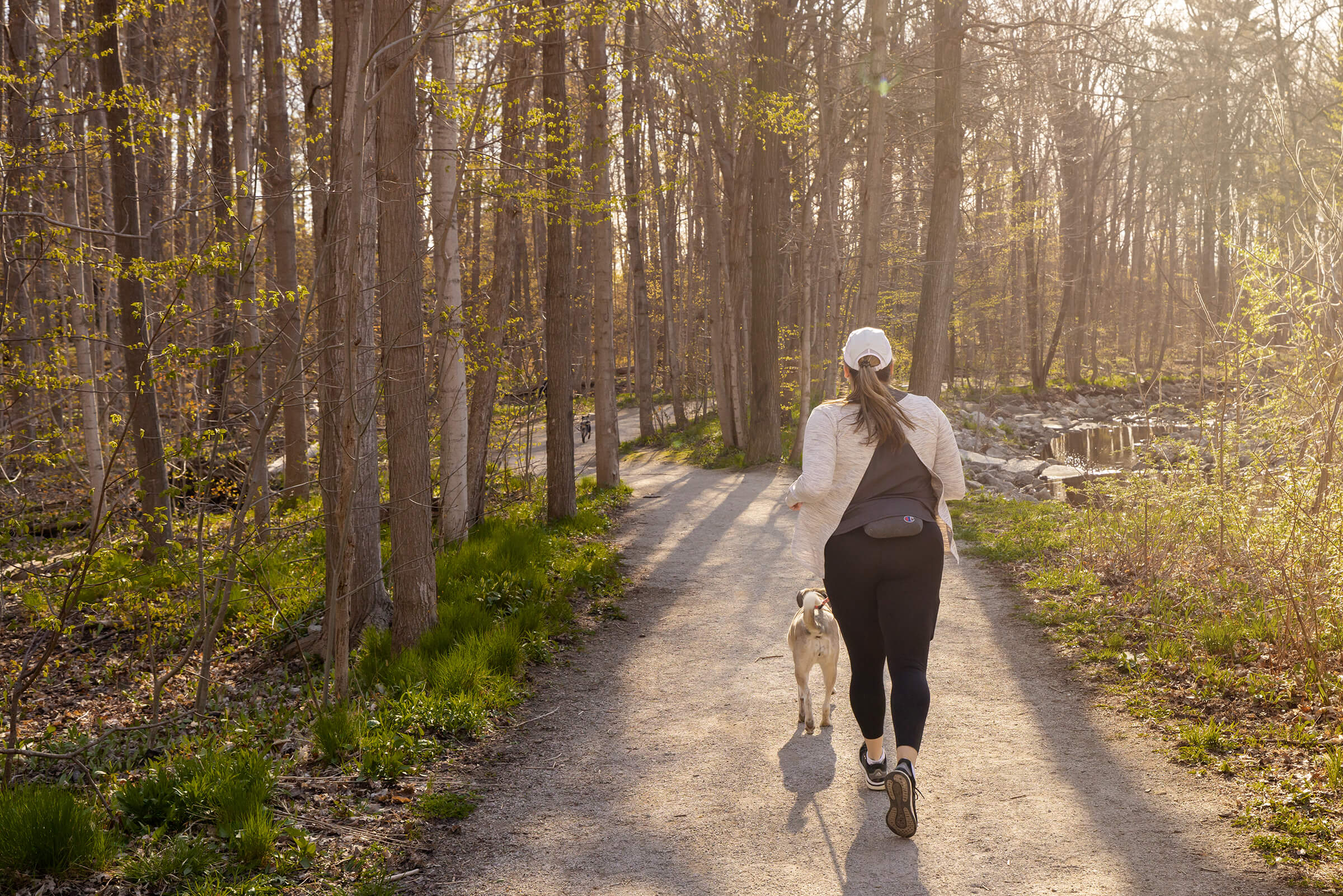 woman running with dog in the GTA